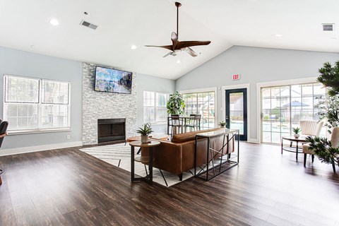 a living room with a table and a fireplace